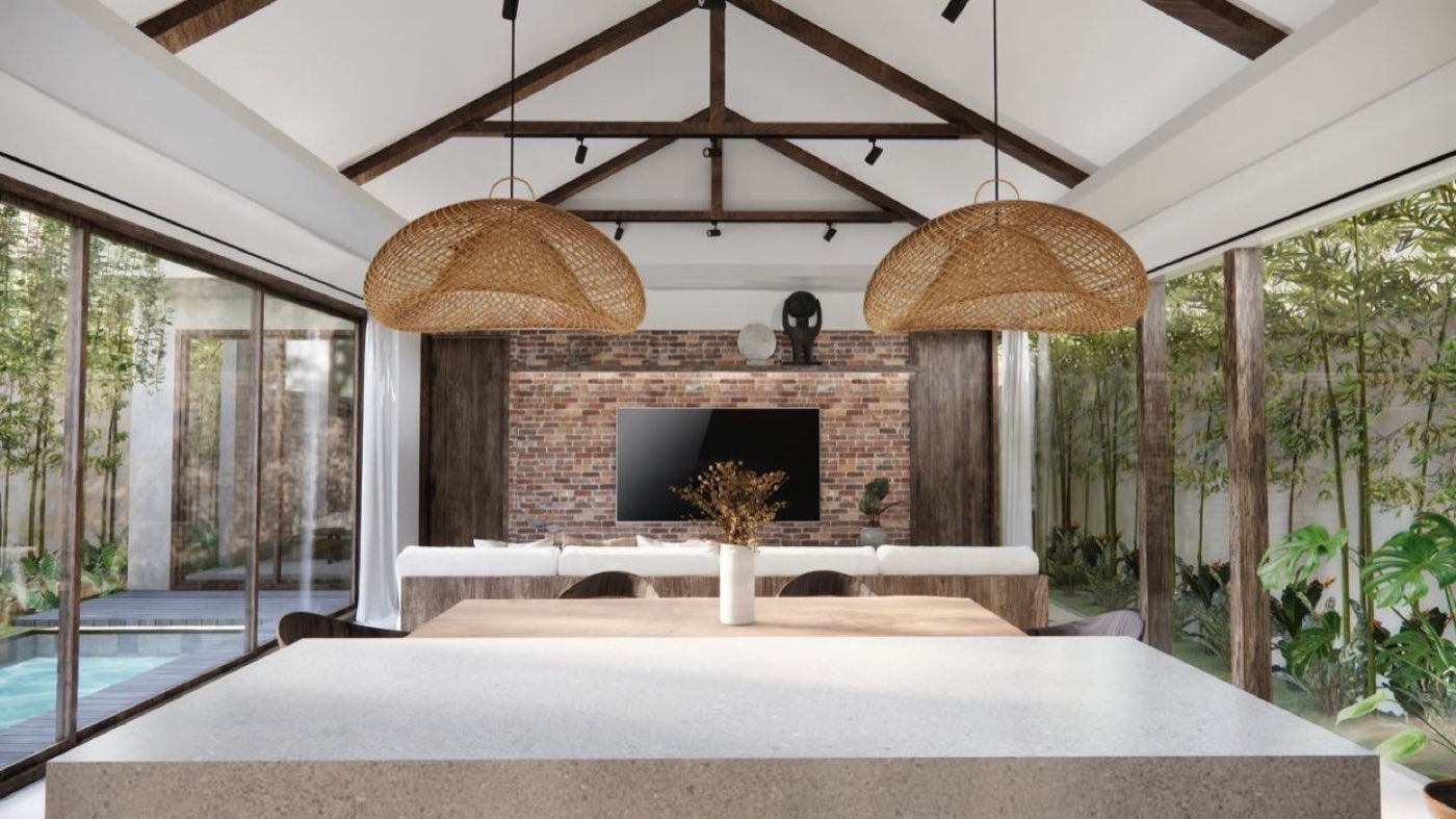Casa Lilee garden villa: concrete kitchen island and living room under an exposed timber truss.