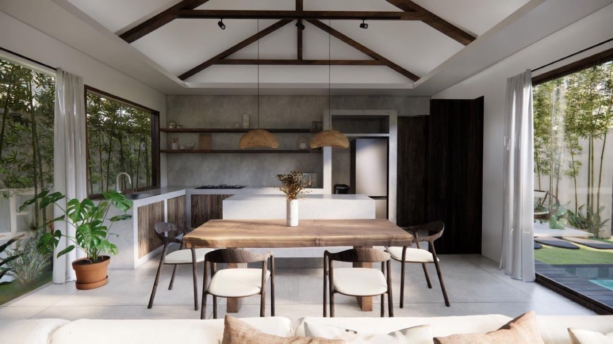 Kitchen and dining with a board-formed concrete island, rattan pendants and glazing on both long walls