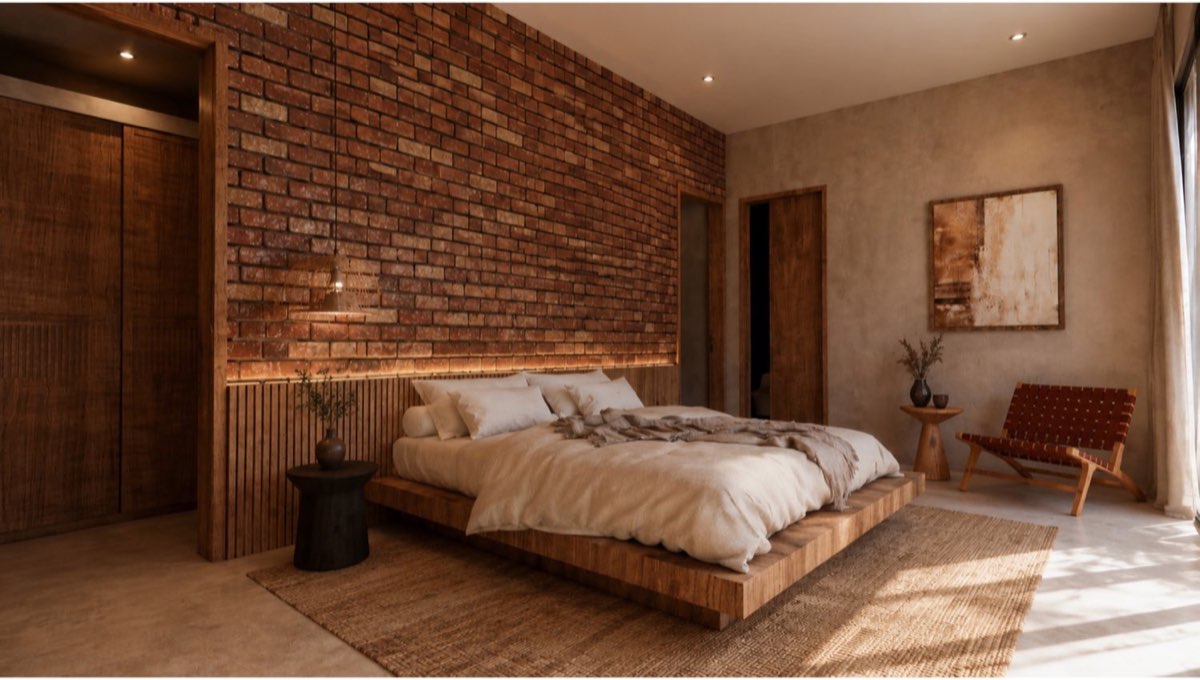Master bedroom with brick wall, fluted timber headboard panel and a platform bed on a woven rug